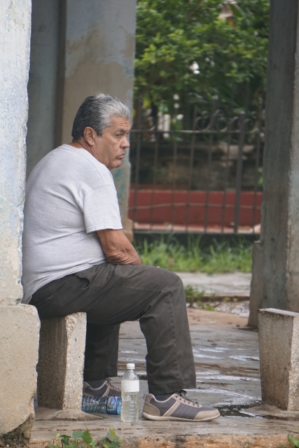 Man seated outside in Havana, Cuba.